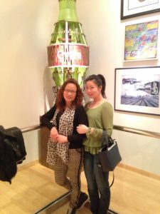 Wenshu Li with another person at Coke museum.