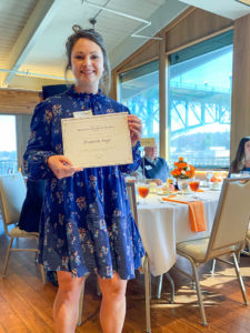 Photograph of Graduate Student of the Year Award Winner, Elizabeth Boyd, holding certificate and smiling.