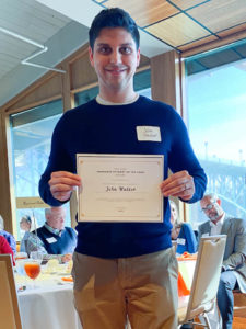 Photo of Graduate Student of the Year Award Winner, John Walker, holding certificate and smiling.